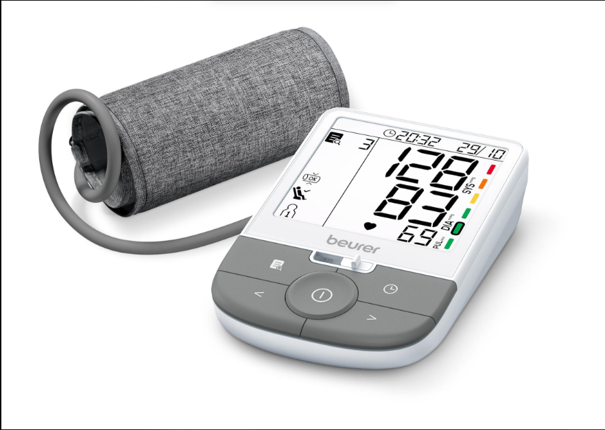 Digital blood pressure monitor with arm cuff showing a reading on its large display